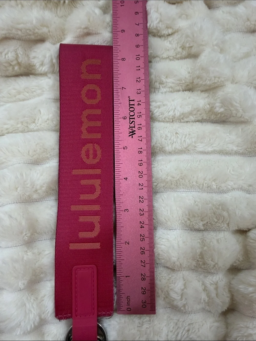 lululemon pink logo wristlet strap with orange lettering